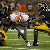 ST. LOUIS, MO - AUGUST 30:   Daniel Dufrene #22 of the University of Illinois Fighting Illini has the ball stripped by Sean Witherspoon #12 of the University of Missouri Tigers during the State Farm Arch Rivalry game at the Edward Jones Dome on August 30,