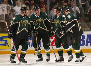 DALLAS - APRIL 12:  (L-R) Shayne Corson #72, Chris Therien #6, Steve Ott #29 and Bill Guerin #13 of the Dallas Stars share some words during a break in game three of the first round of the 2004 Stanley Cup Playoffs against the Colorado Avalanche at the Am