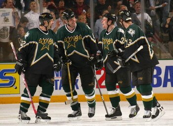 DALLAS - APRIL 12:  (L-R) Shayne Corson #72, Chris Therien #6, Steve Ott #29 and Bill Guerin #13 of the Dallas Stars share some words during a break in game three of the first round of the 2004 Stanley Cup Playoffs against the Colorado Avalanche at the Am