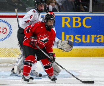 LONDON,ON - JANUARY 3:  Andrew Agozzino #15 of Team Ontario stands in front of Carter Ashton #9 of Team West in a game on January 3, 2008 at the John Labatt Centre in London, Ontario. Team Ontario defeated Team West 4-3 to earn a spot in the gold medal ga