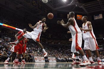 MILWAUKEE - MARCH 26: Brandon Jennings #3 of the West team (L) passes off to Willie Warren #12 under the basket during the McDonald's All-American High School basketball game on March 26, 2008 at the Bradley Center in Milwaukee, Wisconsin. (Photo by Jonat
