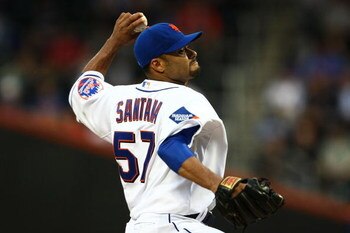 NEW YORK - MAY 11:  Johan Santana #57 of the New York Mets pitches against the Atlanta Braves on May 11, 2009 at Citi Field in the Flushing neighborhood of the Queens borough of New York City.  (Photo by Jim McIsaac/Getty Images)