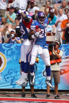 HONOLULU, HI - FEBRUARY 10:  Running Adrian Peterson #28 of the NFC's Minnesota Vikings does a celebratory hip bump with teammate Tony Richardson #49 after Peterson scores a touchdown to give the NFC its first lead over the AFC during the 2008 NFL Pro Bow