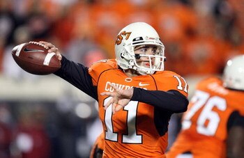 STILLWATER, OK - NOVEMBER 29: Quarterback Zac Robinson #11 of the Oklahoma State Cowboys drops back to pass against the Oklahoma Sooners at Boone Pickens Stadium on November 29, 2008 in Stillwater, Oklahoma. (Photo by Ronald Martinez/Getty Images)
