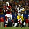 TAMPA, FL - FEBRUARY 01:  Wide receiver Larry Fitzgerald #11 of the Arizona Cardinals scores a 64-yard touchdown reception in the fourth quarter against James Harrison #92 of the Pittsburgh Steelers during Super Bowl XLIII on February 1, 2009 at Raymond J
