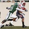 EAST LANSING, MI - NOVEMBER 01: John Clay #32 of the Wisconsin Badgers tries to get around the tackle of Otis Wiley #21 of the Michigan State Spartans during a second quarter run on November 1, 2008 at Spartan Stadium in East Lansing, Michigan.  (Photo by