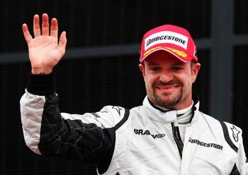 NORTHAMPTON, UNITED KINGDOM - JUNE 21:  Third placed Rubens Barrichello (R) of Brazil and Brawn GP celebrates on the podium after the British Formula One Grand Prix at Silverstone on June 21, 2009 in Northampton, England.  (Photo by Clive Mason/Getty Imag