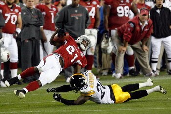 TAMPA, FL - FEBRUARY 01:  Wide receiver Anquan Boldin #81 of the Arizona Cardinals makes a reception against Bryant McFadden #20 of the Pittsburgh Steelers during Super Bowl XLIII on February 1, 2009 at Raymond James Stadium in Tampa, Florida.  (Photo by 