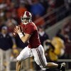 TUSCALOOSA, AL - NOVEMBER 29:  Quarterback Greg McElroy #12 of the Alabama Crimson Tide rolls out to pass against the Auburn Tigers at Bryant-Denny Stadium on November 29, 2008 in Tuscaloosa, Alabama. Alabama defeated Auburn 36-0.  (Photo by Doug Benc/Get