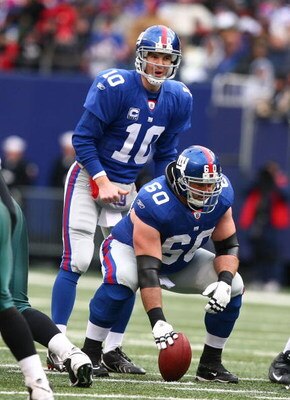 EAST RUTHERFORD, NJ - DECEMBER 07:  Eli Manning #10 and Shaun O'Hara #60 of the New York Giants line up for a play against  the Philadelphia Eagles during their game on December 7, 2008 at Giants Stadium in East Rutherford, New Jersey.  (Photo by Al Bello