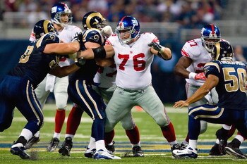ST. LOUIS, MO - SEPTEMBER 14:  Chris Snee #76 of the New York Giants blocks the line during the game against the St. Louis Rams at Edward Jones Dome on September 14, 2008 in St. Louis, Missouri. (Photo by Dilip Vishwanat/Getty Images)