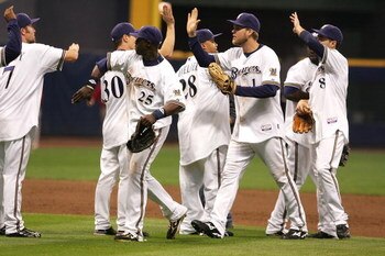 MILWAUKEE - OCTOBER 04:  (L-R) J.J. Hardy #7, Craig Counsell #30, Mike Cameron #25, Prince Fielder #28, Corey Hart #1 and Ryan Braun #8 of the Milwaukee Brewers celebrate their 4-1 win against the Philadelphia Phillies in Game three of the NLDS during the