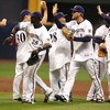 MILWAUKEE - OCTOBER 04:  (L-R) J.J. Hardy #7, Craig Counsell #30, Mike Cameron #25, Prince Fielder #28, Corey Hart #1 and Ryan Braun #8 of the Milwaukee Brewers celebrate their 4-1 win against the Philadelphia Phillies in Game three of the NLDS during the