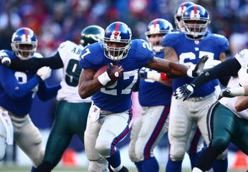 EAST RUTHERFORD, NJ -  JANUARY 11:  Brandon Jacobs #27 of the New York Giants runs the ball against the Philadelphia Eagles during the NFC Divisional Playoff Game on January 11, 2009 at Giants Stadium in East Rutherford, New Jersey.  The Eagles defeated t
