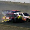 SONOMA, CA - JUNE 21: Greg Biffle, driver of the #16 3M/Post-it Ford, collides with Kyle Busch, driver of the #18 M&M's Toyota, and David Ruetimann, driver of the #00 Aaron's Dream Machine Toyota, during the NASCAR Sprint Cup Series Toyota/Save Mart 350 a