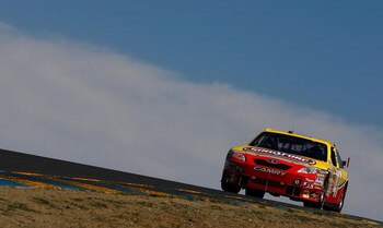 SONOMA, CA - JUNE 19: Marcos Ambrose, driver of the #47 Little Debbie/Kingsford/Clorox Toyota, drives during qualifying for the NASCAR Sprint Cup Series Toyota/Save Mart 350 at the Infineon Raceway on June 19, 2009 in Sonoma, California.  (Photo by Jonath
