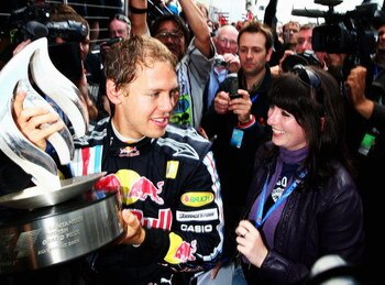 NORTHAMPTON, UNITED KINGDOM - JUNE 21:  Sebastian Vettel of Germany and Red Bull Racing celebrates with team mates in the paddock after winning the British Formula One Grand Prix at Silverstone on June 21, 2009 in Northampton, England.  (Photo by Clive Ma