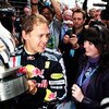NORTHAMPTON, UNITED KINGDOM - JUNE 21:  Sebastian Vettel of Germany and Red Bull Racing celebrates with team mates in the paddock after winning the British Formula One Grand Prix at Silverstone on June 21, 2009 in Northampton, England.  (Photo by Clive Ma