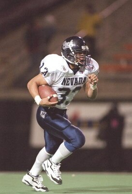 13 Dec 1996:  Chris Lemon of the Nevada Wolf Pack runs with the football during the Las Vegas Bowl game against the Ball State Cardinals at Sam Boyd Stadium in Las Vegas, Nevada.  Nevada won the game 18-15. Mandatory Credit: Jamie Squire  /Allsport