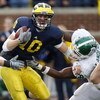 ANN ARBOR, MI - OCTOBER 25: Steven Threet #10 of the Michigan Wolverines tries to get around the tackle of Todd Anderson #58 of the Michigan State Spartans during a third quarter sack on October 25, 2008 at Michigan Stadium in Ann Arbor, Michigan. Michiga