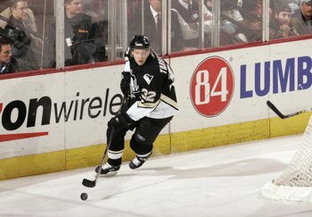 PITTSBURGH - DECEMBER 8: Dick Tarnstrom #32 of the Pittsburgh Penguins skates with the puck during the game against the Minnesota Wild at Mellon Arena on December 8, 2005 in Pittsburgh, Pennsylvania. Minnesota won 5-0. (Photo By Gregory Shamus/Getty Image