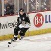 PITTSBURGH - DECEMBER 8: Dick Tarnstrom #32 of the Pittsburgh Penguins skates with the puck during the game against the Minnesota Wild at Mellon Arena on December 8, 2005 in Pittsburgh, Pennsylvania. Minnesota won 5-0. (Photo By Gregory Shamus/Getty Image