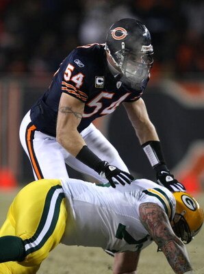 CHICAGO - DECEMBER 22: Brian Urlacher #54 of the Chicago Bears sheds a block by Daryn Colledge #73 of the Green Bay Packers on December 22, 2008 at Soldier Field in Chicago, Illinois. The Bears defeated the Packers 20-17 in overtime. (Photo by Jonathan Da