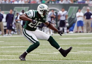 EAST RUTHERFORD, NJ - SEPTEMBER 14: Kerry Rhodes #25 of the New York Jets celebrates a defensive play against the New England Patriots on September 14, 2008 at Giants Stadium in East Rutherford, New Jersey.  (Photo by Jim McIsaac/Getty Images)