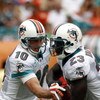 MIAMI - OCTOBER 19: Quarterback Chad Pennington #10 of the Miami Dolphins hands off to teammate Running back Ronnie Brown #23 against the Baltimore Ravens in the first quarter at Dolphin Stadium on October 19, 2008 in Miami, Florida. (Photo by Eliot J. Sc