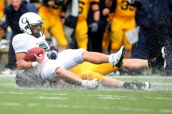 BERKELEY, CA - NOVEMBER 01:  Jeremiah Masoli #2 of the Oregon Ducks is sacked by Zack Follett #56 of the California Golden Bears during an NCAA football game on November 1, 2008 at Memorial Stadium in Berkeley, California.  (Photo by Jed Jacobsohn/Getty I