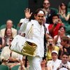 WIMBLEDON, ENGLAND - JUNE 22:  Roger Federer of Switzerland waves to the crowd prior to the men's singles first round match against Yen-Hsun Lu of Chinese Taipei on Day One of the Wimbledon Lawn Tennis Championships at the All England Lawn Tennis and Croq