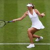 WIMBLEDON, ENGLAND - JUNE 22:  Maria Sharapova of Russia plays a forehand during the women's singles first round match against Viktoriya Kutuzova of Ukraine on Day One of the Wimbledon Lawn Tennis Championships at the All England Lawn Tennis and Croquet C