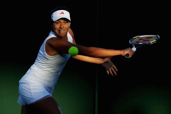 WIMBLEDON, ENGLAND - JUNE 23:  Ana Ivanovic of Serbia plays a backhand during the women's singles first round match against Lucie Hradecka of Czech Republic on Day Two of the Wimbledon Lawn Tennis Championships at the All England Lawn Tennis and Croquet C