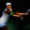 WIMBLEDON, ENGLAND - JUNE 23:  Ana Ivanovic of Serbia plays a backhand during the women's singles first round match against Lucie Hradecka of Czech Republic on Day Two of the Wimbledon Lawn Tennis Championships at the All England Lawn Tennis and Croquet C