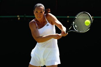 WIMBLEDON, ENGLAND - JUNE 23:  Jelena Jankovic of Serbia plays a backhand during the women's singles final match against Julia Goerges of Germany on Day Two of the Wimbledon Lawn Tennis Championships at the All England Lawn Tennis and Croquet Club on June