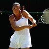 WIMBLEDON, ENGLAND - JUNE 23:  Jelena Jankovic of Serbia plays a backhand during the women's singles final match against Julia Goerges of Germany on Day Two of the Wimbledon Lawn Tennis Championships at the All England Lawn Tennis and Croquet Club on June
