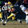 GREEN BAY, WI - DECEMBER 28: Ryan Grant #25 of the Green Bay Packers runs past Daniel Bullocks #27 of the Detroit Lions on December 28, 2008 at Lambeau Field in Green Bay, Wisconsin. The Packers defeated the Lions 31-21. (Photo by Jonathan Daniel/Getty Im