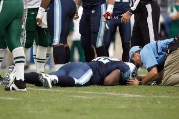 NASHVILLE, TN - NOVEMBER 23:  Albert Haynesworth #92 of the Tennessee Titans lays hurt on the field during the game against the New York Jets at LP Field on November 23, 2008 in Nashville, Tennessee. (Photo by Kevin C. Cox/Getty Images)