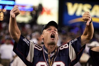 FOXBORO, MA - SEPTEMBER 8:  A fan of the New England Patriots boos the Oakland Raiders before their 2005 NFL opening game at Gillette Stadium on September 8, 2005 in Foxboro, Massachusetts.  (Photo by Nick Laham/Getty Images)