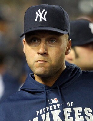 NEW YORK - JUNE 17:  An injured Derek Jeter #2 of the New York Yankees looks on from the dugout against the Washington Nationals on June 17, 2009 at Yankee Stadium in the Bronx borough of New York City. The Nationals defeated the Yankees 3-2.  (Photo by J