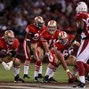 SAN FRANCISCO - SEPTEMBER 10:  Eric Heitmann #66 and Justin Smiley #65 wait on the offensive line as quarterback Alex Smith #11 of the San Francisco 49ers calls a play during an NFL game against the Arizona Cardinals on September 10, 2007 at Monster Park 