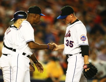 NEW YORK - SEPTEMBER 26: Joe Smith #35  of the New York Mets hands the ball to Manager Willie Randolph and leaves the game after giving up two runs in the fifth inning against the Washington Nationals during their game at Shea Stadium on September 26, 200