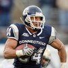 EAST HARTFORD, CT - DECEMBER 06:  Donald Brown #34 of the Connecticut Huskies carries the ball in the second half against the Pittsburgh Panthers on December 6, 2008 at Rentschler Field in East Hartford, Connecticut. The Panthers defeated the Huskies 34-1