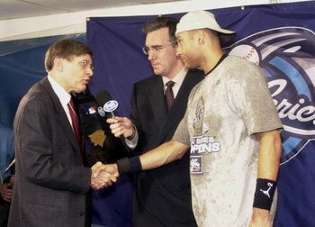 26 Oct 2000:  Derek Jeter of the New York Yankees is awarded the MVP trophy by commissioner Bud Selig after the Yankees defeated the New York Mets 4-2 during Game 5 of the World Series at Shea Stadium in Flushing, New York. <DIGITAL IMAGE> Mandatory Credi