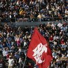 PASADENA, CA - NOVEMBER 6:  A cheerleader waves a Washington State Cougars flag during the game against the UCLA Bruins on November 6, 2004 at the Rose Bowl in Pasadena, California.   The Cougars defeated the Bruins 31-29.  (Photo by Stephen Dunn/Getty Im
