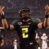SAN DIEGO, CA - DECEMBER 30:   Quarterback Jeremiah Masoli #2 of the University of Oregon Ducks runs into the endzone for a touchdown against the Oklahoma State University Cowboys during the Pacific Life Holiday Bowl at Qualcomm Stadium on December 30, 20