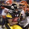 PITTSBURGH - NOVEMBER 20:  Mewelde Moore #21 of the Pittsburgh Steelers gets tackled by Domata Peko #94 of the Cincinnati Bengals during the third quarter on November 20, 2008 at Heinz Field in Pittsburgh, Pennsylvania. Pittsburgh won the game 27-10.  (Ph