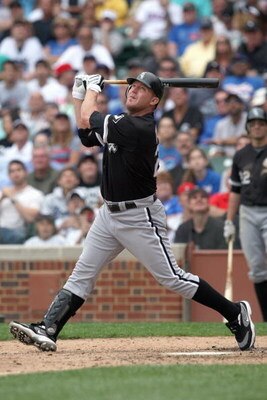 CHICAGO - JUNE 17: Jim Thome #25 of the Chicago White Sox makes a hit against the Chicago Cubs on June 17, 2009 at Wrigley Field in Chicago, Illinois. (Photo by Jonathan Daniel/Getty Images)