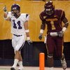 MINNEAPOLIS - NOVEMBER 01:  Jeremy Ebert #11 of the Northwestern Wildcats celebrates his touchdown for a 7-0 lead in front of Tramaine Brock #1 of the Minnesota Golden Gophers during the first quarter at the Hubert H.Humphrey Metrodome on November 1, 2008