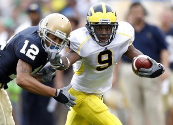 SOUTH BEND, IN - SEPTEMBER 13:  Martavious Odoms #9 of the Michigan Wolverines tries to get around Robert Blanton #12 of the Notre Dame Fighting Irish during a second quarter action on September 13, 2008 at Notre Dame Stadium in South Bend, Indiana.  (Pho